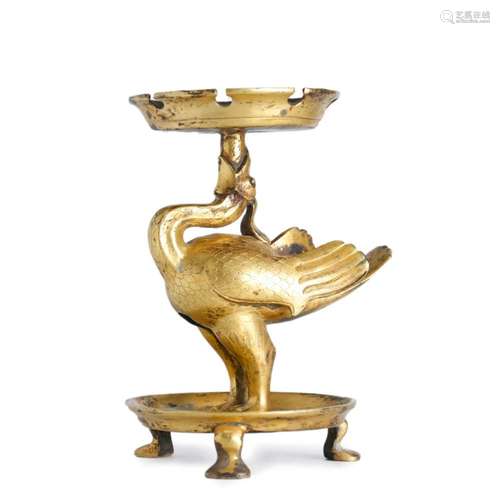 A GILT BRONZE MYTHICAL BEAST CANDLE STICK