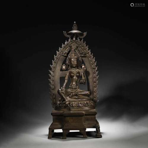 A SILVER-INLAID COPPER GREEN TARA STATUE