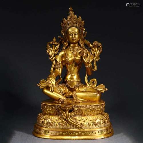 A GILT-BRONZE STATUE OF GREEN TARA