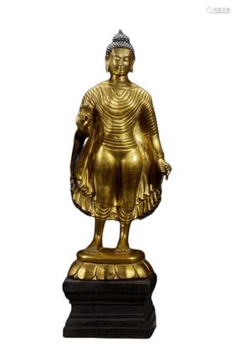 A GILT BRONZE FIGURE OF SHAKYAMUNI