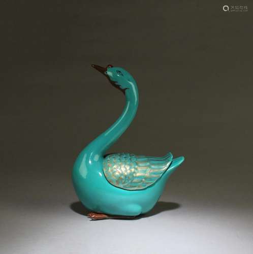 A TORQUOISE COLOR PORCELAIN DUCK FIGURINE