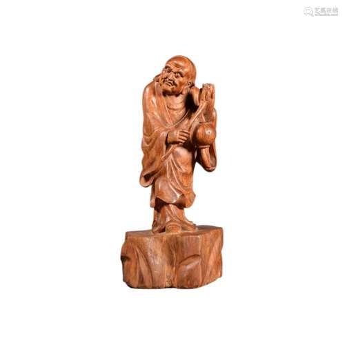 A HUANGHUALI CARVED FIGURE OF BODHIDHARMA