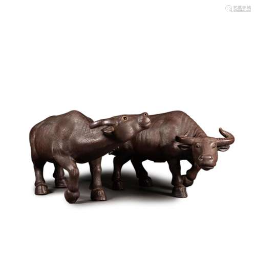 A PAIR OF PORCELAIN OXEN