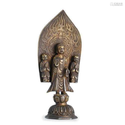 A GILDING SILVER BUDDHA WITH ATTENDANTS