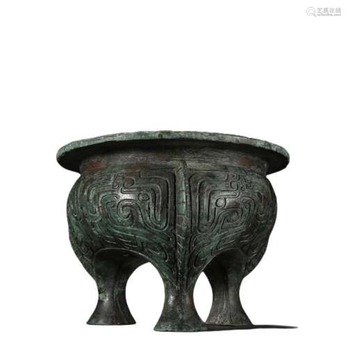 A BRONZE MYTHICAL BEAST DING VESSEL