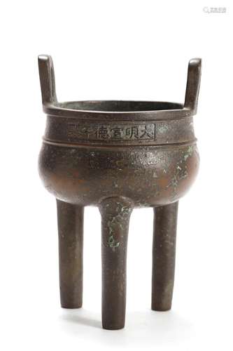 A BRONZE TRIPOD CENSER