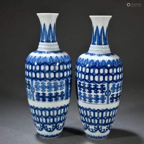 Pair of willow leaf vases with blue and white geometric patt...
