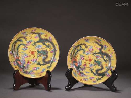 A pair of yellow-ground famille rose dragon and phoenix dish...