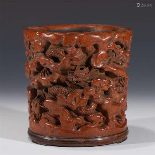 A CHINESE CARVED BAMBOO DRAGON BRUSHPOT