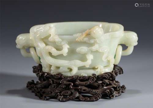 A CHINESE CARVED WHITE JADE DRAGON CUP