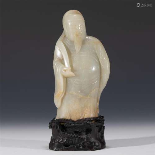 A CHINESE CARVED JADE BEARDED DIGNITARY
