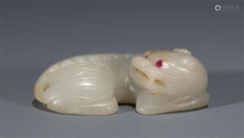 A CHINESE CARVED WHITE JADE BUDDHIST LION