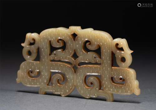 A CHINESE ARCHAISTIC CARVED JADE DECORATION