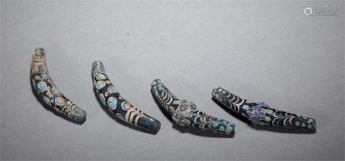 A GROUP OF FOUR GLASS DRAGONFLY EYES BEADS