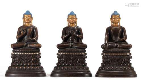 A RARE SET OF THREE TIBETAN BRONZE COSMIC BUDDHA