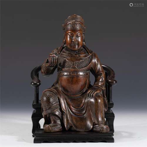 A CHINESE CARVED ALOES WOOD SEATED GUANDI