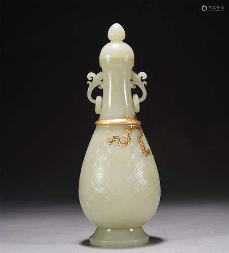 A CHINESE CARVED JADE VASE