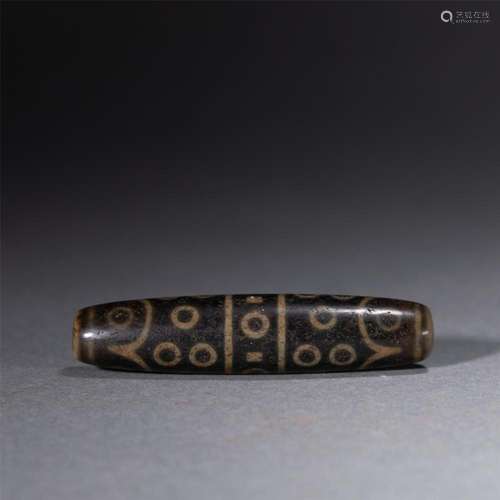 A FINE AND RARE TIBETAN DZI BEAD