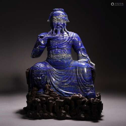 A CHINESE CARVED LAPIS GUANDI DECORATION