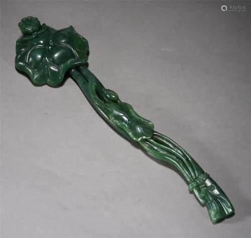 A CHINESE CARVED SPINACH GREEN JADE RUYI SCEPTER