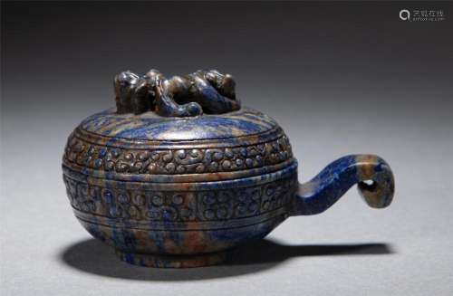 A CHINESE ARCHAISTIC CARVED LAPIS VESSEL