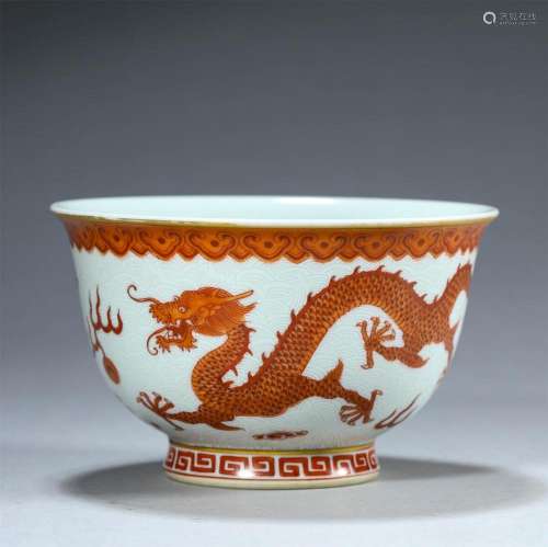 A CHINESE IRON RED AND GILT DRAGON CUP