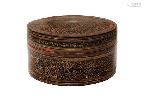 A BURMESE RED AND BLACK LACQUER 'MYTHICAL CREATURE' BETEL-BO...