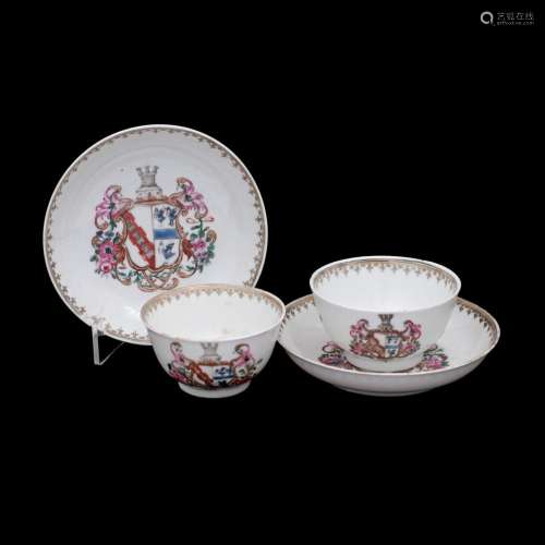 A PAIR OF ARMORIAL CUPS AND SAUCERS