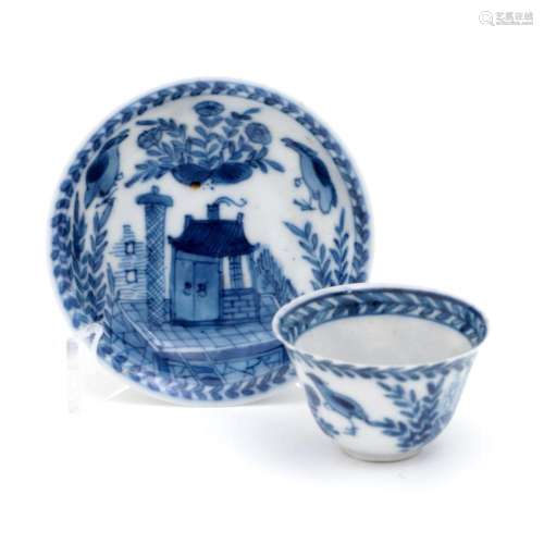 A MINIATURE CUP AND SAUCER