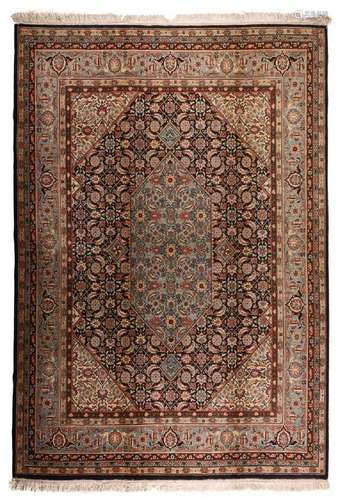 AN ORIENTAL RUG