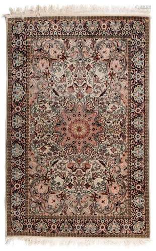 AN ORIENTAL CARPET