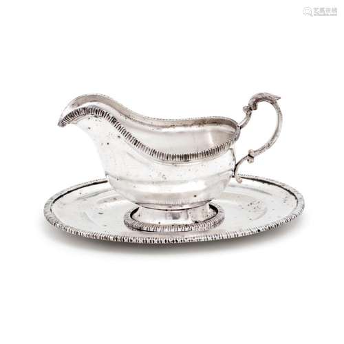 A GRAVY BOAT WITH PLATTER