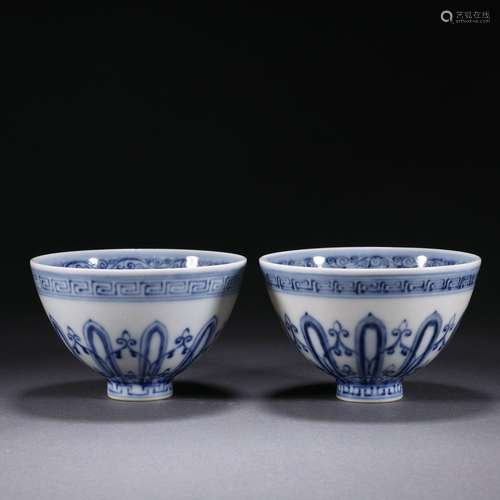 A pair of blue and white cups