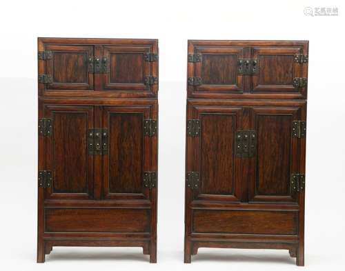 A pair of wooden cabinets