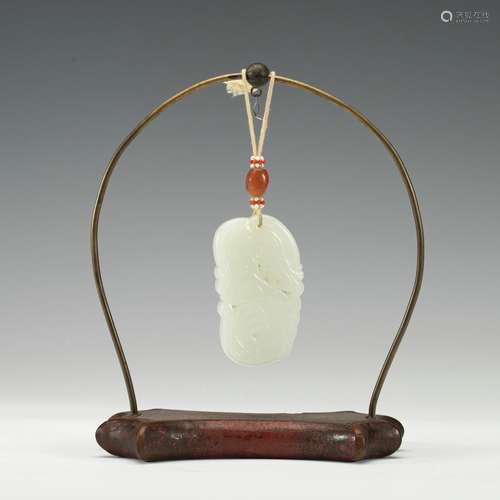 A white jade pendant