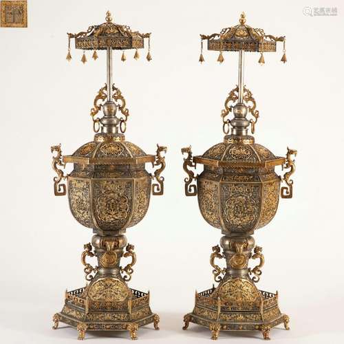 A Pair of silver gilt stoves