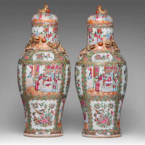 A pair of Chinese Canton famille rose baluster vases and lid...