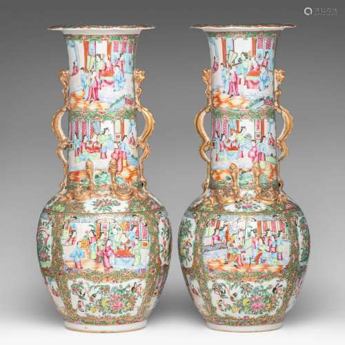 A pair of Chinese Canton famille rose bottle vases, paired w...