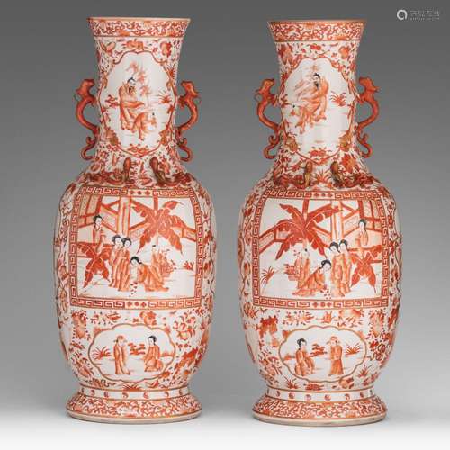 A pair of Chinese iron-red vases, paired with dragon handles...