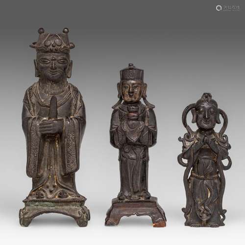 A collection of three Chinese bronze figures of standing Imm...