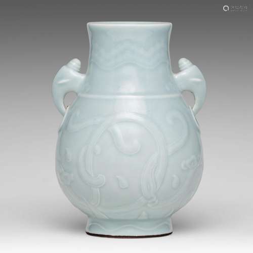 A Chinese carved celadon glazed hu vase, paired with mythica...