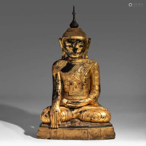 An impressive Burmese gilt lacquered wooden seated Buddha, l...