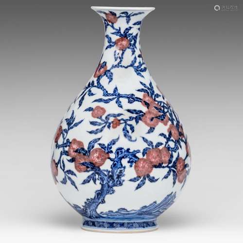 A Chinese blue and white and copper red 'Peaches' yuhuchunpi...