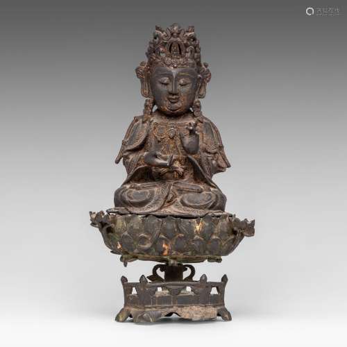 A Chinese gilt lacquered bronze figure of seated Bodhisattva...