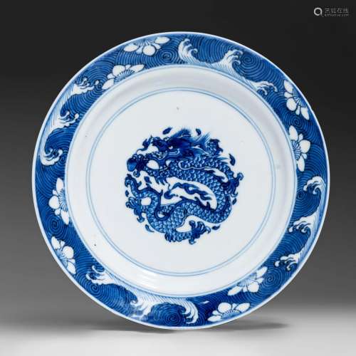 A Chinese blue and white 'Dragon' dish, Kangxi period and sy...