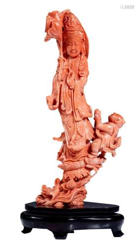 A Chinese finely carved coral figure of standing Guanyin, la...