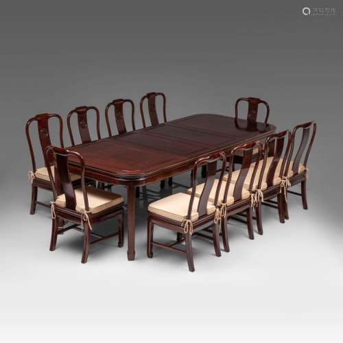 A Chinese rosewood dinner ensemble: dinner table (incl. exte...