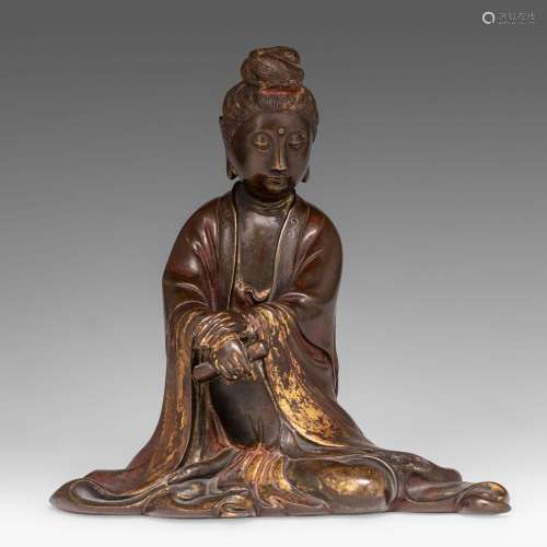 A Chinese Song-Yuan style gilt bronze figure of seated Guany...