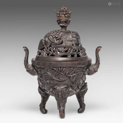 A Chinese bronze 'Elephant' tripod censer and cover, paired ...