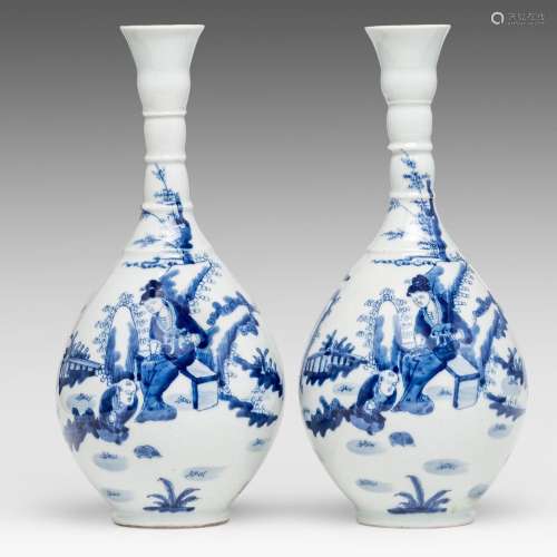 Two nearly identical Chinese blue and white bottle vases, wi...